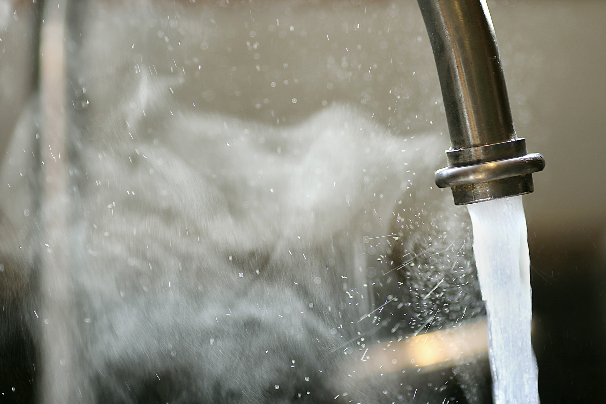 Hot Steaming Water Running from Kitchen Faucet